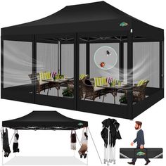 a large black tent with people walking around it