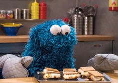 the cookie monster is ready to eat some sandwiches