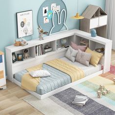 a child's bedroom with blue walls and white furniture