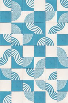 a blue and white tile pattern with wavy lines