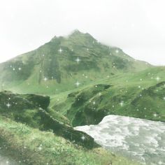 an image of a mountain with snow falling on the grass and stars in the sky