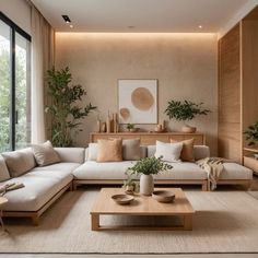 a living room filled with lots of furniture next to a large glass window and potted plants