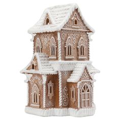 a gingerbread house with snow on the roof and windows, in front of a white background