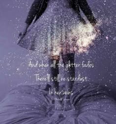 a woman standing on top of a bed under a sky filled with stars and the words, and when all the glitter fadess there's still be stardust in her hands