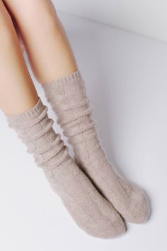 A beautiful cable knit design adds the perfect touch of detail to our ultra cozy Cable Cashmere Socks. They make for the perfect lounging staple or can be styled with your favorite boots. 105 grams of cashmere blend in 7-gauge knit Cable knit finish 96% Cashmere 1% Spandex 3% Nylon Hand Wash Cold or Dry Clean Only Size & Fit S/M: US women's 6-8 M/L: US women's 8-11 (men's size 6.5-9.5) Cashmere Socks, Favorite Boots, Navy Color, Free Bag, Knitting Designs, Knee High Sock, Cable Knit, Cashmere, Dry Clean