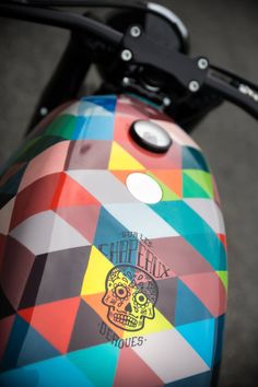 a colorful motorcycle with a skull painted on the side