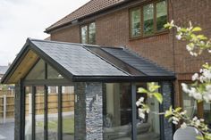 a house with a glass extension to the roof