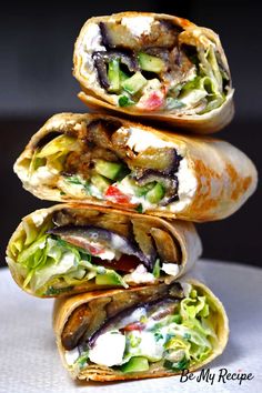 three burritos stacked on top of each other