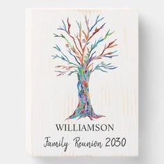 a family tree is painted on a wooden plaque with the name and date, william and family reunion 2009