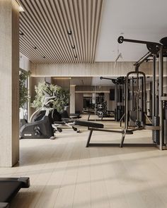 an empty gym with machines and treadmills