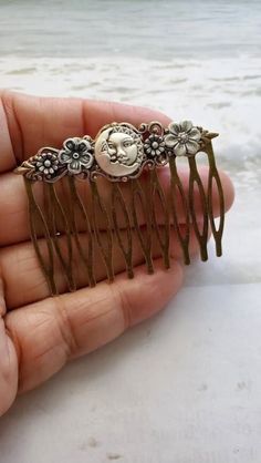 Moon Haircomb This Crescent Moon face Hair Comb makes a lovely hair accessory for beautiful hair styles. This haircomb is charming with elegant and amazing Flowers. It is great for special occasions like weddings, but can also be great for everyday wear ☻Link to More Hair Accessories: https://www.etsy.com/shop/FashionCrashJewelry?ref=profile_header&search_query=hair+accessories ☻Link to The ENTIRE SHOP: https://www.etsy.com/shop/FashionCrashJewelry?ref=shopsection_shophome_leftnav&ga_search_quer Flower Hairpiece, Celestial Gifts, Pin Man, Man In The Moon, Yokai Watch, In The Moon