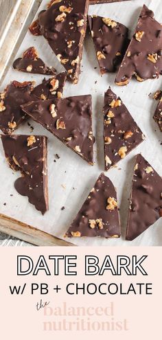 there are many pieces of chocolate with nuts on it in the baking pan, ready to be eaten