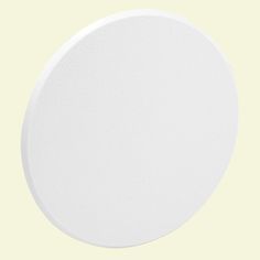 a white round object on a yellow background