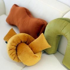 pillows and cushions on a white couch