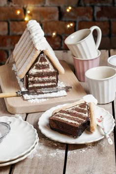 a slice of cake sitting on top of a white plate next to a cup and saucer