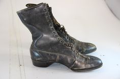 These are original women's victorian shoes. The have a date and a women's name written inside the shoe. The pair is in fair condition, with normal wear and tear for its age. Would be great for a shop display, wedding decor or set design. Victorian Black Boots For Formal Occasions, Black Victorian Boots For Formal Occasions, 1900 Shoes, 1900s Shoes Women, 1910 Shoes, 1912 Shoes, 1800’ Shoes Women, Lady Elizabeth, Victorian Shoes