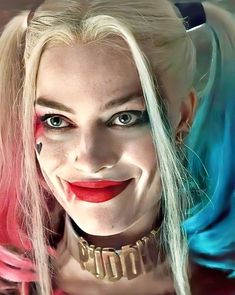 a close up of a person with makeup on and hair in the shape of harley