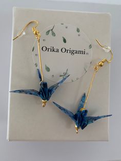 the origami bird earrings are on display