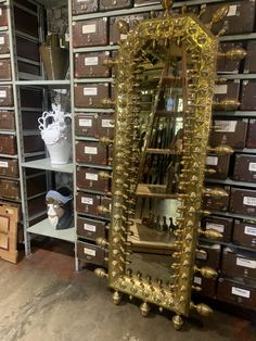 a large mirror sitting on top of a shelf in a room filled with boxes and other items