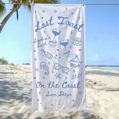 a towel hanging from a clothes line on the beach with words last toast on it