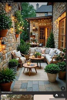 an outdoor living area with couches, tables and potted plants