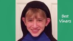 a young boy wearing a black and blue hoodie with the words cool vines on it