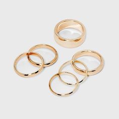 Update your ring collection with this 6-Piece Band Ring Set from A New Day™. This beautiful ring set includes six rings featuring a simple band design with varying thickness. Each ring features a gold-tone metal finish to add sheen to your looks. Pair with blouse-and-jeans combos to black dresses for easy styling with a variety of outfits.

A New Day™: Style that goes wherever you do. Jewelry Hacks, Dalmation Jasper, Simple Band, Gold Ring Sets, Ring Collections, Universal Thread, A New Day, Gold Tone Metal, Cute Jewelry