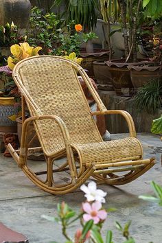 a wicker rocking chair sitting on top of a patio