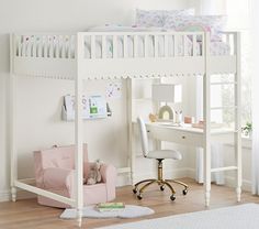 a white loft bed sitting next to a desk and chair