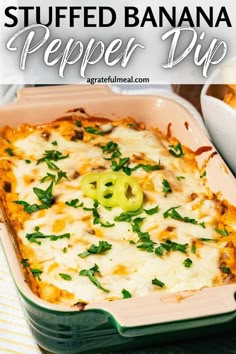 a casserole dish with cheese and green peppers