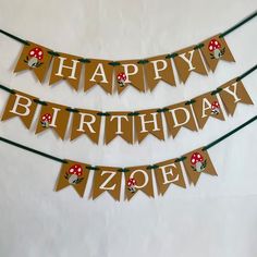 a happy birthday banner with mushrooms on it