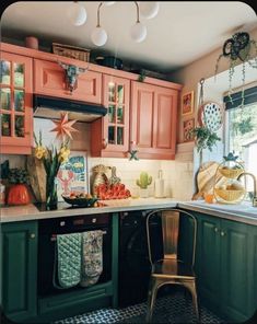 a kitchen filled with lots of green cabinets