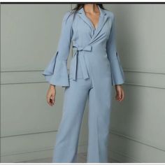 Blue Jumpsuit, Wide Leg, Never Worn, New With Tags. Size Medium, Fits Between A 2-4. Chic Blue V-neck Pantsuit, Blue Summer Party Suit, Light Blue V-neck Jumpsuit For Party, Chic Fitted Light Blue Jumpsuits And Rompers, Chic Light Blue Fitted Jumpsuits And Rompers, Spring Party Blue Suits, Light Blue Fitted V-neck Jumpsuits And Rompers, Fitted Light Blue V-neck Jumpsuits And Rompers, Blue Long Sleeve Jumpsuit For Work