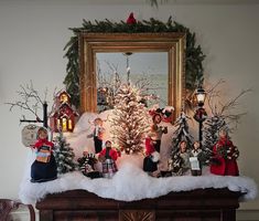 a mantel decorated with christmas trees and other holiday decorations