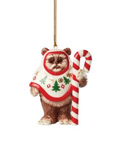 a christmas ornament with a bear holding a candy cane