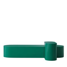 two green plastic cylinders on a white background