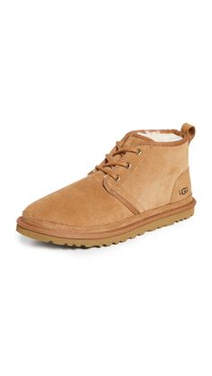 PRICES MAY VARY. Soft suede upper Lightweight and flexible molded EVA outsole Fully lined with UGGpure wool. Cotton laces Wear indoors as a slipper or out with slim jeans and a V-neck 17mm UGGpure wool lining 17mm UGGpure wool insole Ugg Neumel Boots, Ugg Neumel, Mens Uggs, Classic Boots, Ugg Australia, Slim Jeans, Soft Suede, Chukka Boots, Chestnut