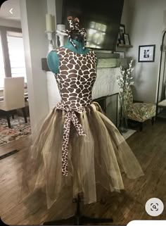 a giraffe print dress on display in a living room