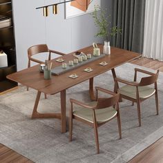 a dining room table with chairs and plates on the placemat in front of it