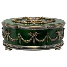 an ornate green box with gold trimmings