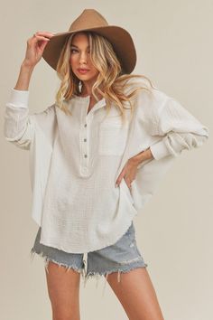 Stay comfy in our Brittany Top featuring a flowy cotton fabrication and effortless design with a button-up henley style with thermal contrasting. Cotton Gauze Top, White Boho Tops, Fresh Linen, Henley Top, Lightweight Tops, Spring Tops, Flowy Tops, Skirt Top, White Tops