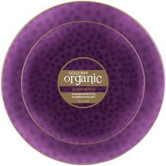 a purple and gold plate with the words organic printed on it's side, in front of a white background