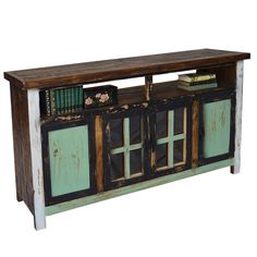 an old wooden sideboard with books on top and stained glass doors, against a white background