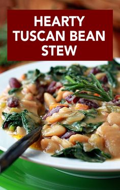 hearty tuscann bean stew with spinach and beans on a white plate