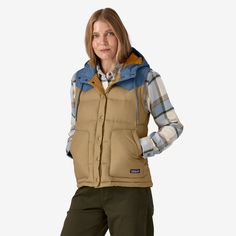 The same warm, cute vest, but easier to wear now that’s it’s made with 100% recycled polyester ripstop. Stuffed with toasty 600-fill-power 100% Recycled Down (duck and goose down reclaimed from down products), this favorite is now Fair Trade Certified™ sewn. | Patagonia Women's Bivy Hooded Down Vest in Classic Tan, Small - Recycled Nylon/Recycled Polyesterpfas Ocean Plastic Pollution, Cute Vest, Women's Vests, Patagonia Vest, Patagonia Women, Fishing Nets, Plastic Pollution, Hooded Vest, Down Vest