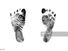 an imprint of a person's foot in black and white