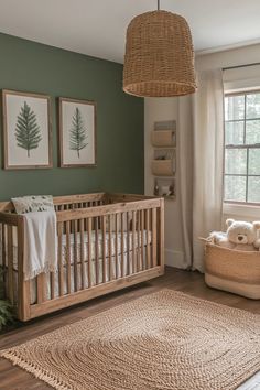 a baby's room with a crib, rug and pictures on the wall