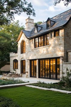 a large stone house with lots of windows