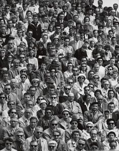 a large group of people sitting next to each other