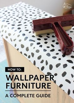 a piece of furniture with the title how to wallpaper furniture, a complete guide